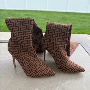 Geometric over-the-knee heels